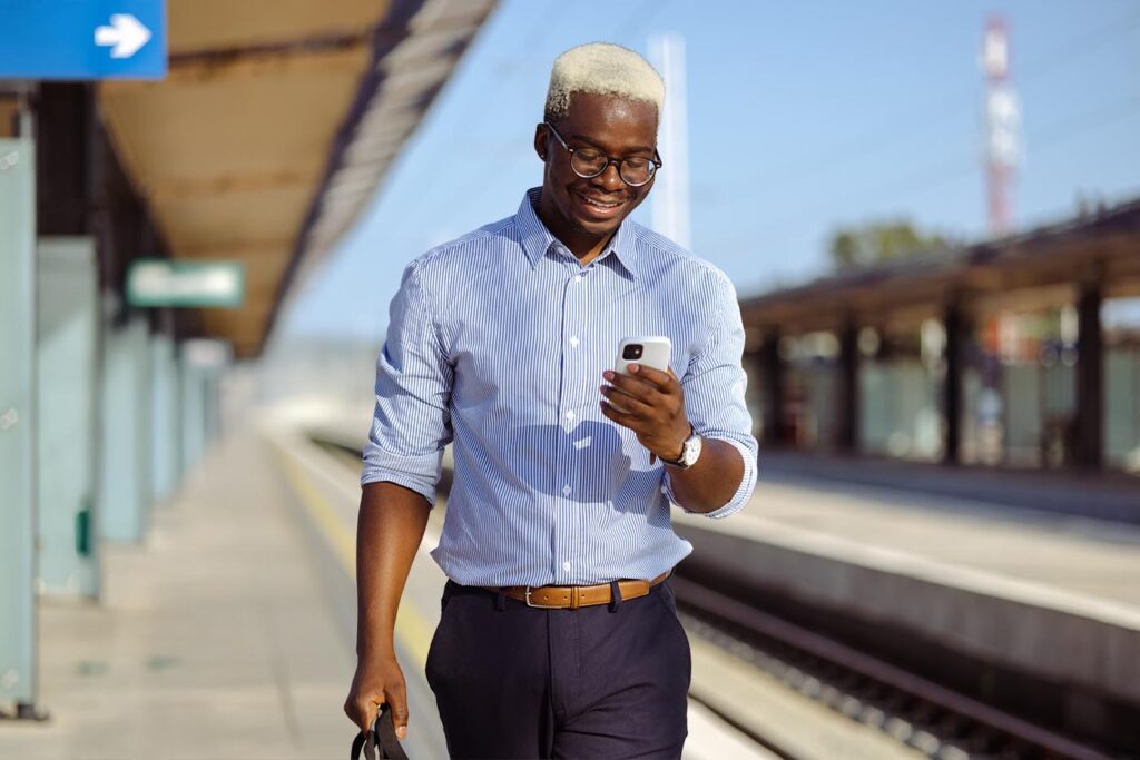 Young African American business man using smart phone
