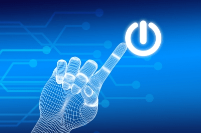 Digital wireframe hand touching a glowing power button against a blue technological background.